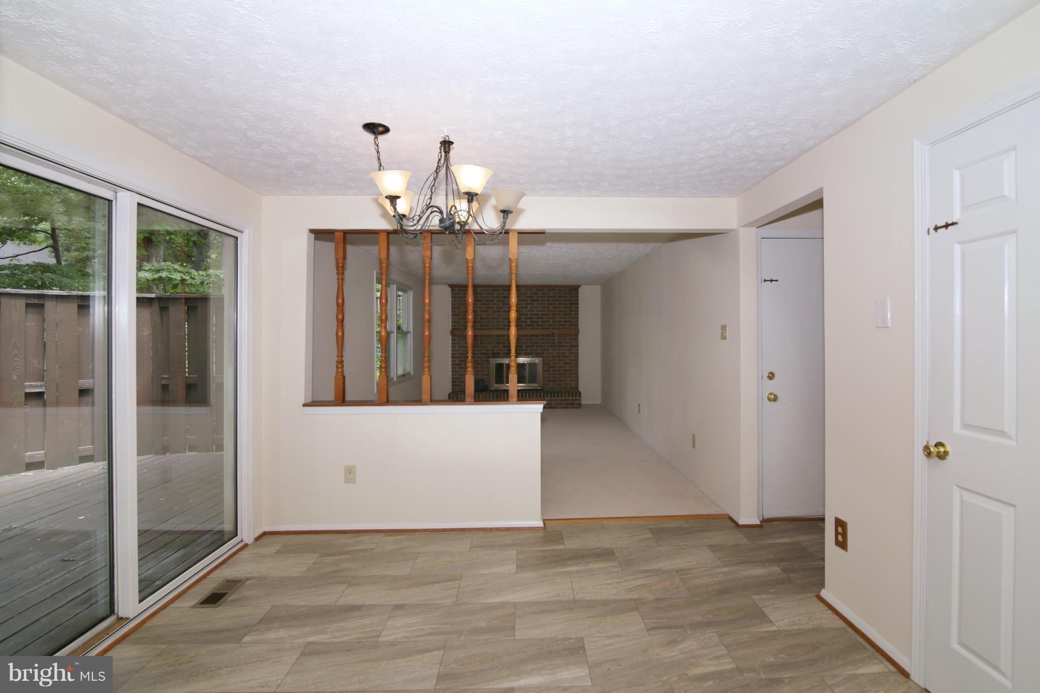 8452 Rushing Creek Court Springfield, VA 22153 - Photo 11 of 30 Large Breakfast Nook with Deck and Wooded Views