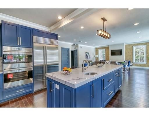 a kitchen with counter space and wooden floors