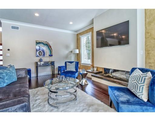 171 Pond Plain Road Westwood, MA 02090 - Photo 14 of 29 a living room with furniture and a flat screen tv