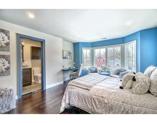 171 Pond Plain Road Westwood, MA 02090 - Photo 22 of 29 a bedroom with a large bed and a large window