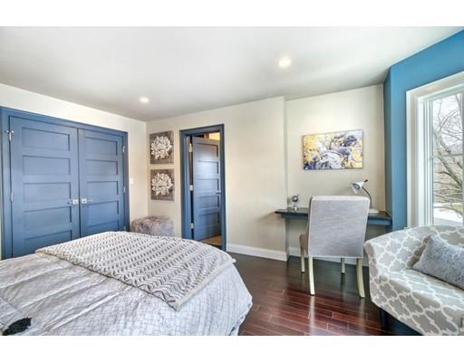 171 Pond Plain Road Westwood, MA 02090 - Photo 23 of 29 a bedroom with a bed and a chair with the wooden floor
