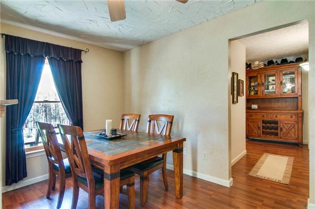 7194 Drag Strip Road Fairview, TN 37062 - Photo 14 of 20 a view of a dining room with furniture and wooden floor