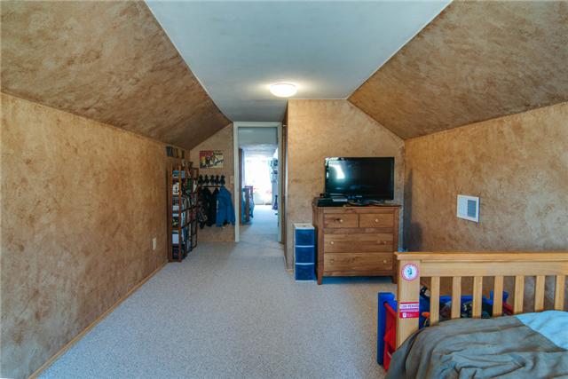 7194 Drag Strip Road Fairview, TN 37062 - Photo 20 of 20 a living room with furniture and a flat screen tv