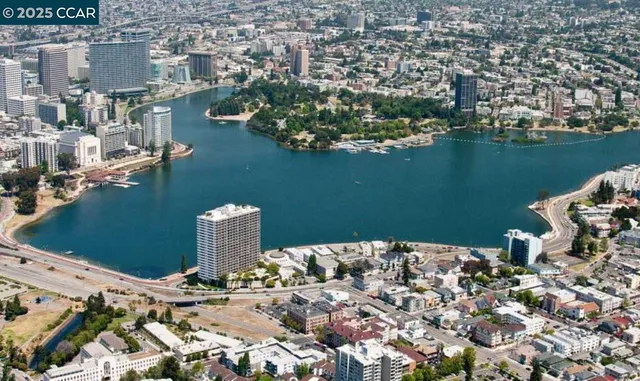 an aerial view of a house with a lake view