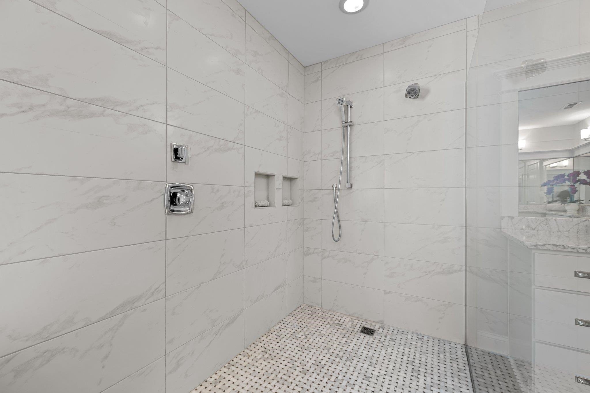 2116 Cowper Drive Raleigh, NC 27608 - Photo 45 of 65 Zero-grade walk-in shower with custom tile surround and floor. Walk-in Shower