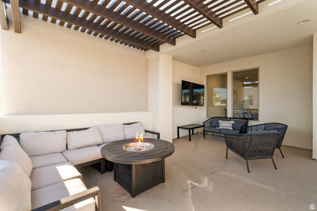 5482 Alice Blue Place St. George, UT 84790 - Photo 29 of 35 Upper patio with fire pit, hot tub, and TV