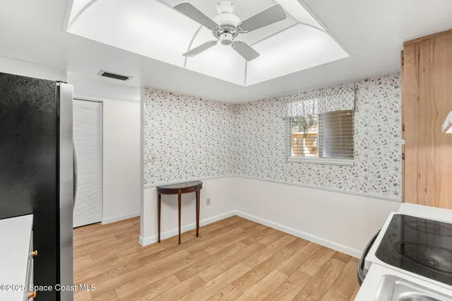 an empty room with a empty space and windows