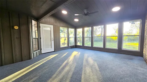 a view of a hallway with a door