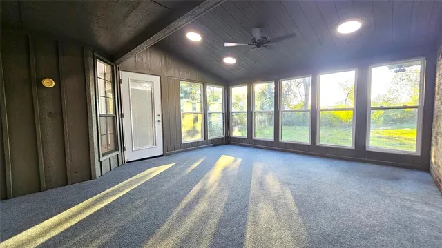 a view of a hallway with a door