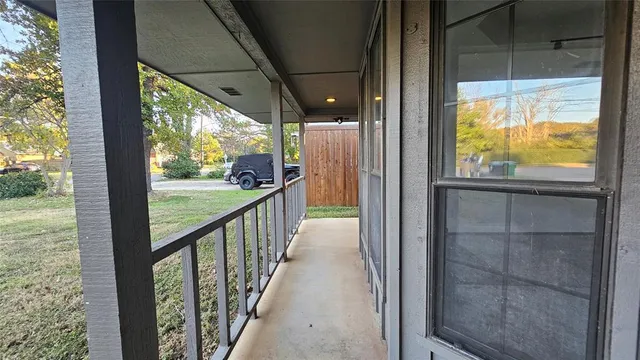 a view of a house with backyard and porch