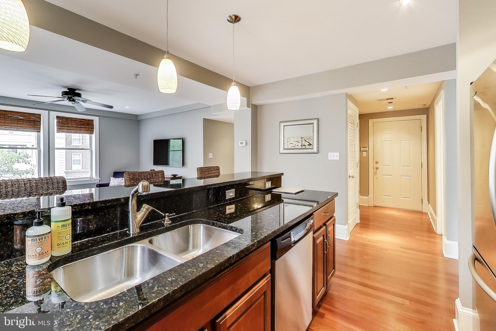 1465 Columbia Road Northwest, Unit 301 Washington, DC 20009 - Photo 4 of 27 Granite countertops and stainless steel appliances