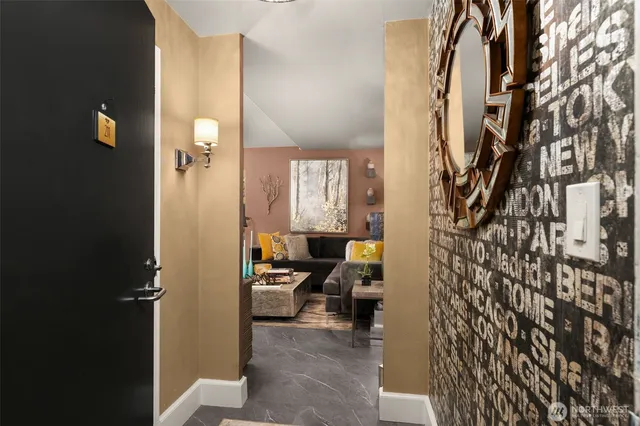 a view of a hallway with couch and closet