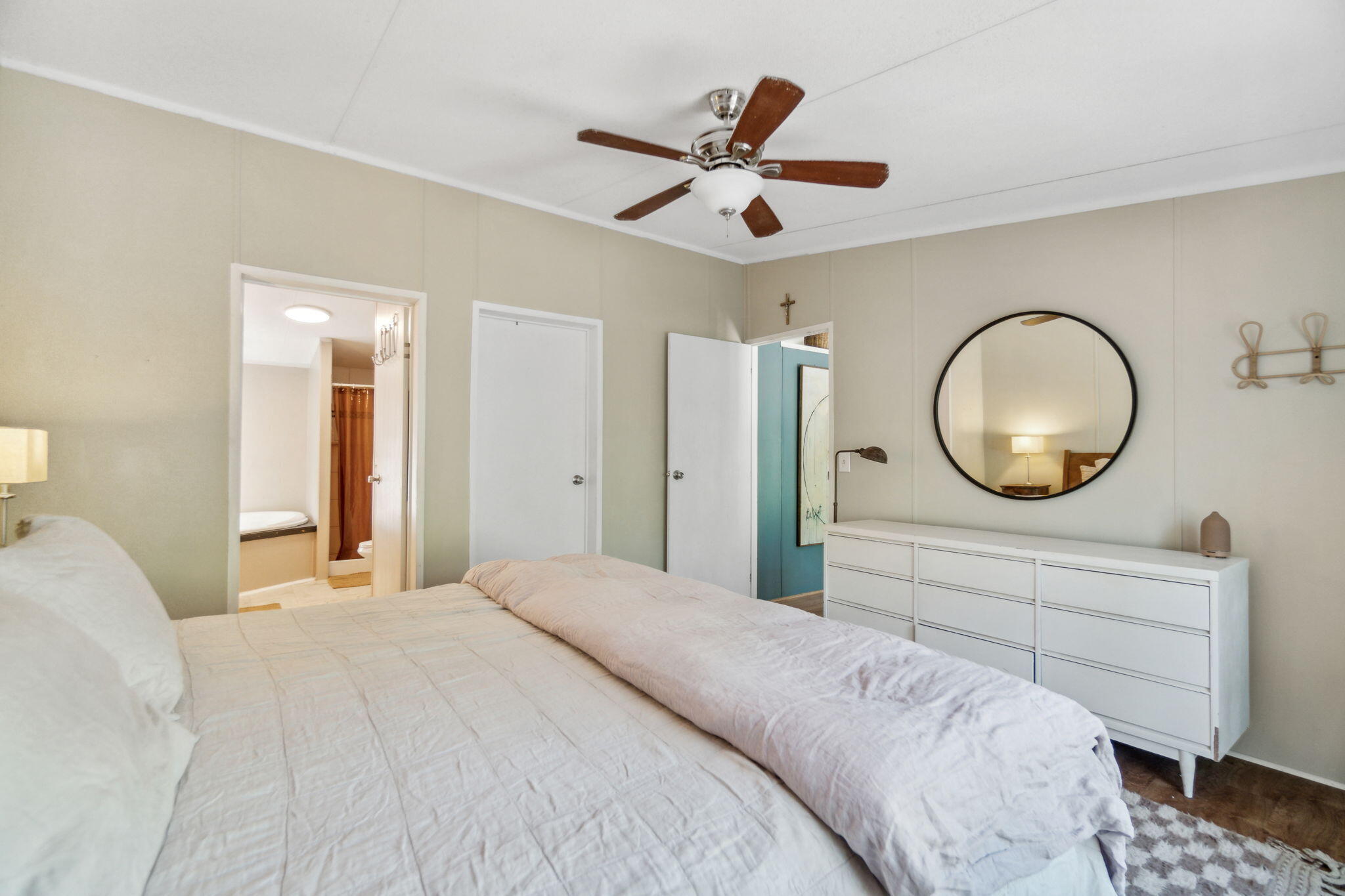 232 Churchill Bayou Road Santa Rosa Beach, FL 32459 - Photo 14 of 32 a bedroom with a large bed and a chandelier