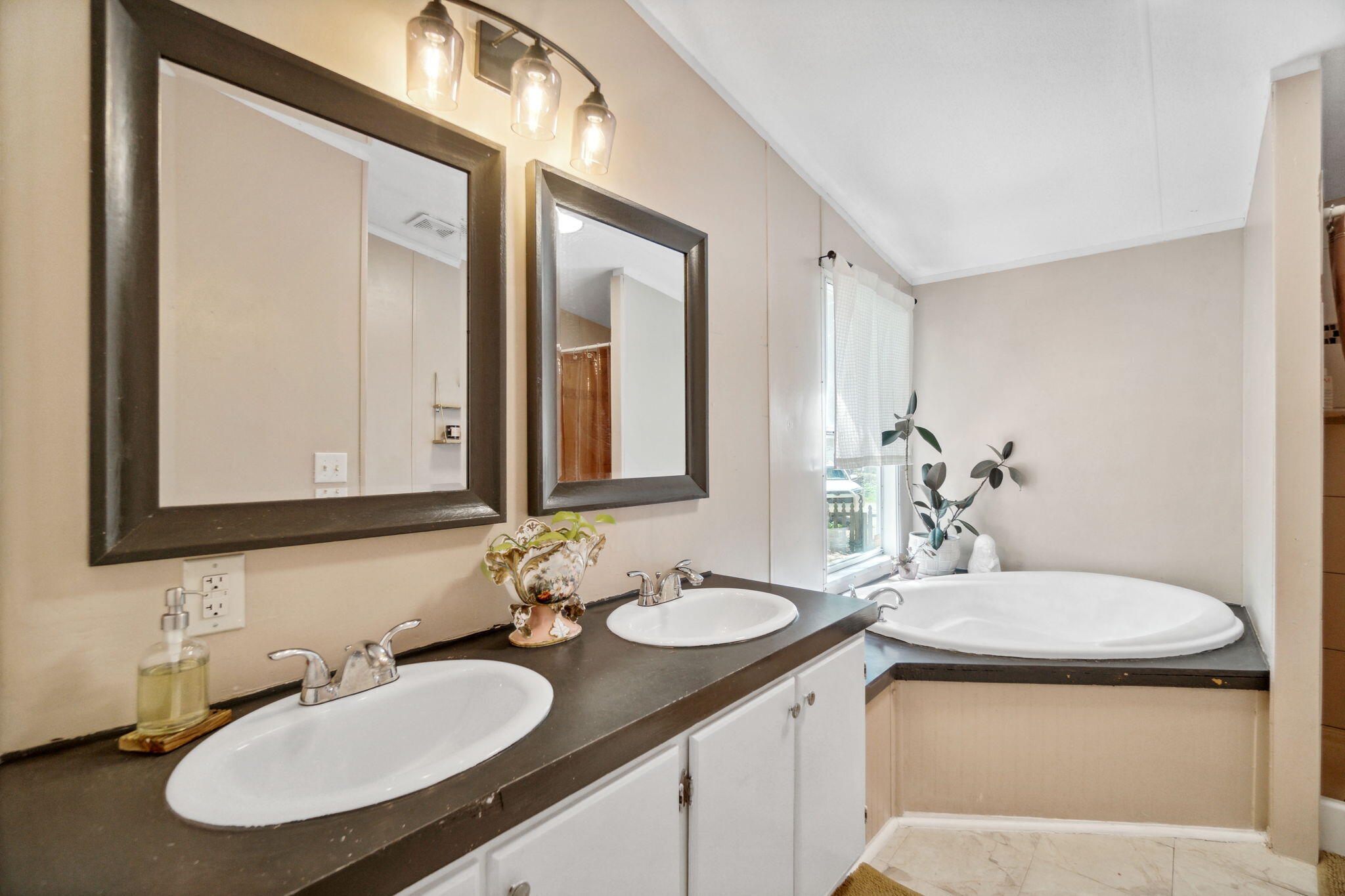 232 Churchill Bayou Road Santa Rosa Beach, FL 32459 - Photo 15 of 32 a bathroom with 2 sink and a mirror