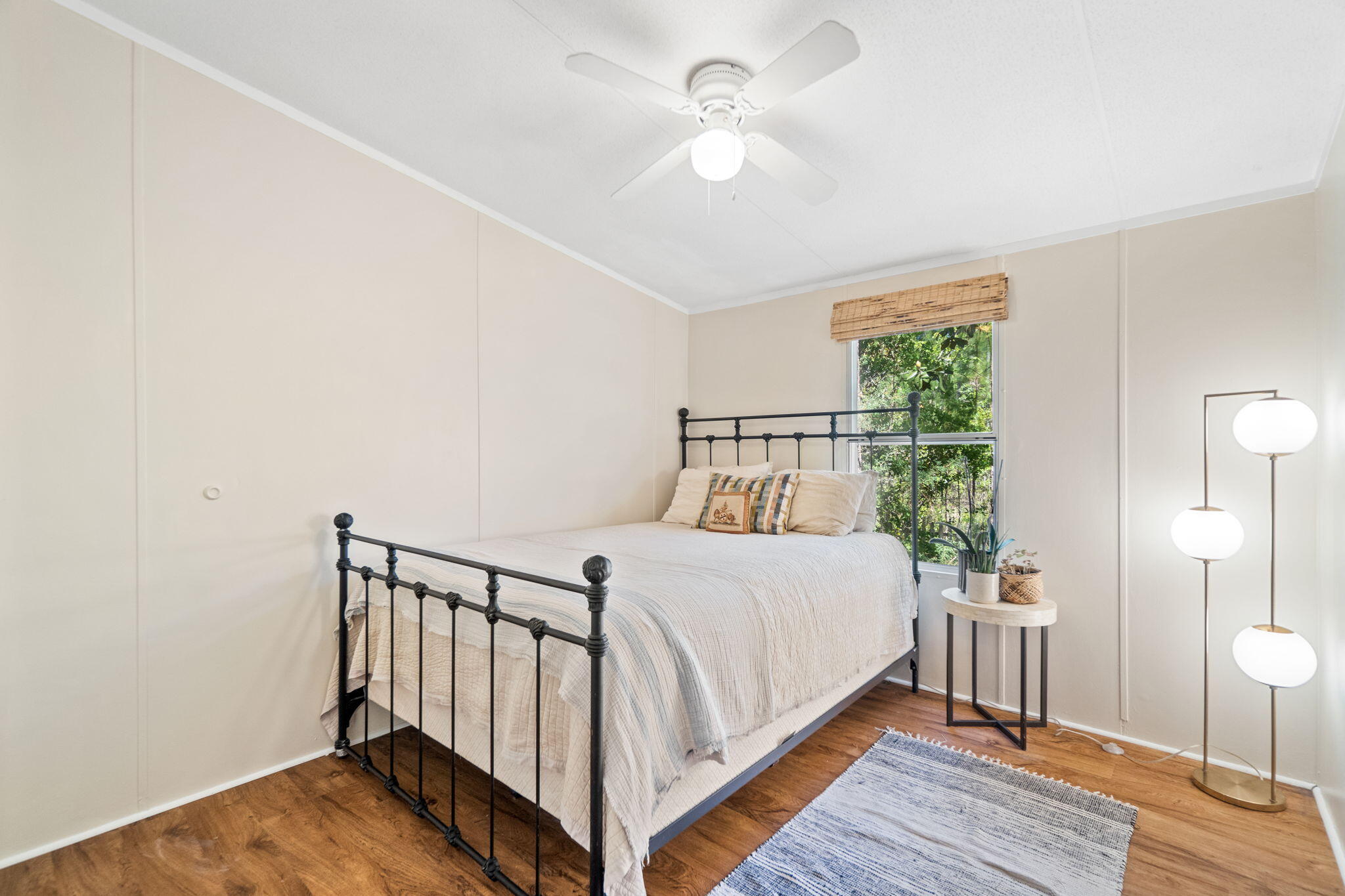 232 Churchill Bayou Road Santa Rosa Beach, FL 32459 - Photo 20 of 32 a bedroom with a bed and a chandelier
