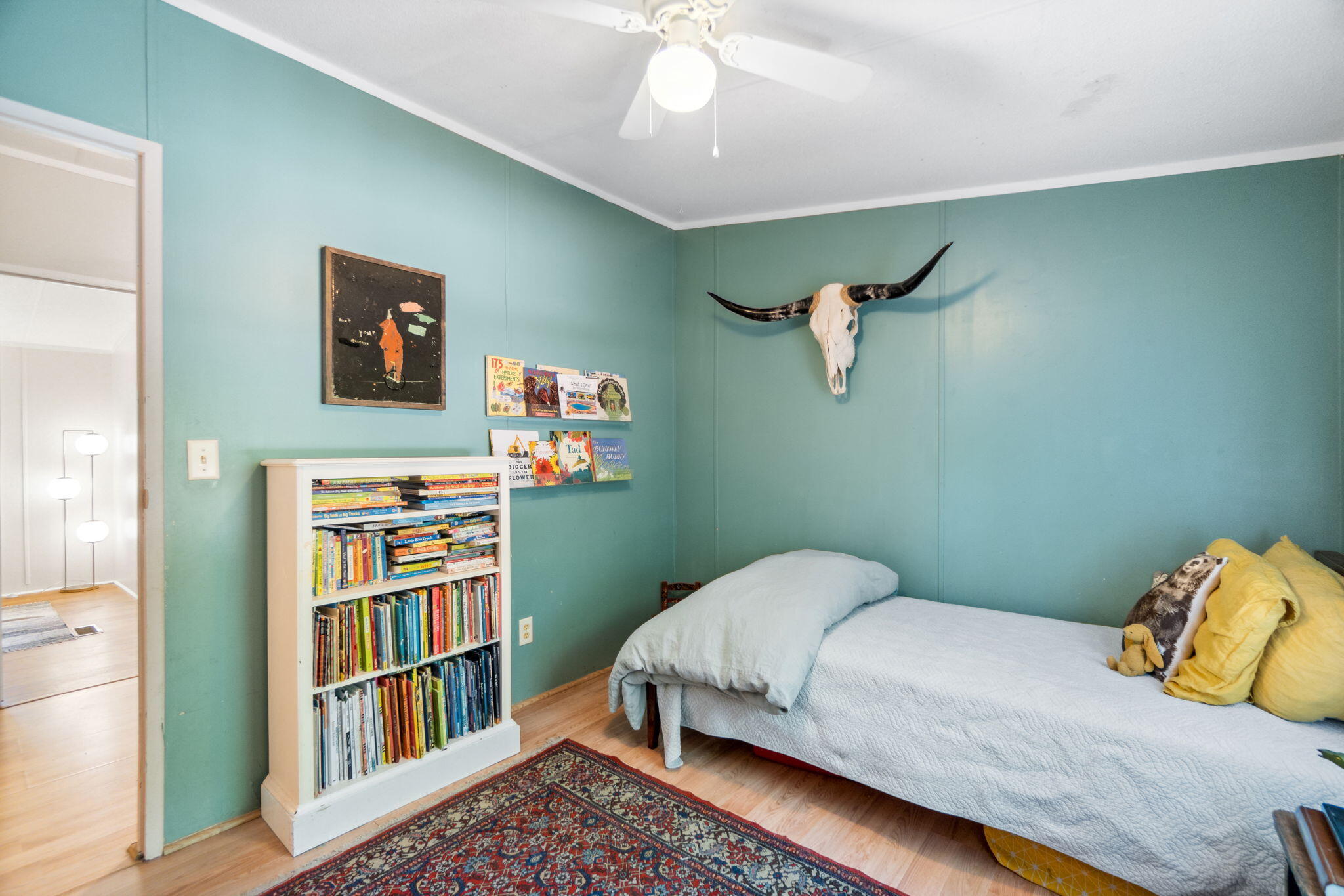 232 Churchill Bayou Road Santa Rosa Beach, FL 32459 - Photo 23 of 32 a bedroom with a bed and a book shelf
