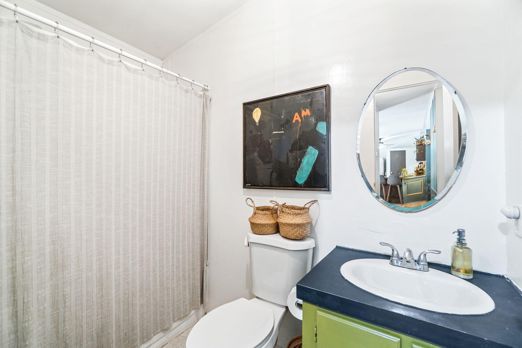 232 Churchill Bayou Road Santa Rosa Beach, FL 32459 - Photo 24 of 32 a bathroom with a toilet a sink and mirror