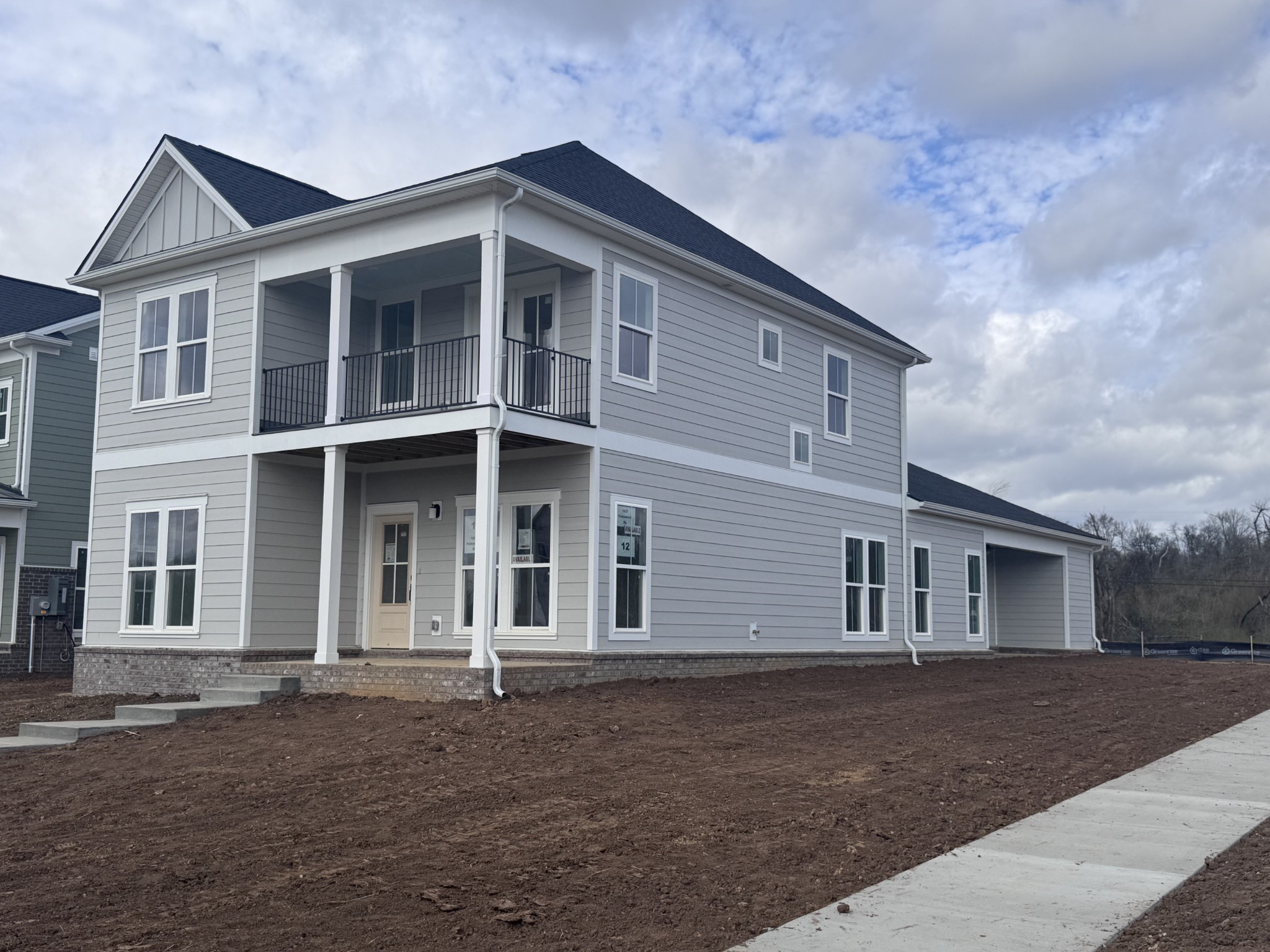 1827 Flatwaters St Spring Hill Spring Hill, TN 37174 - Photo 2 of 6 a front view of a house with a yard