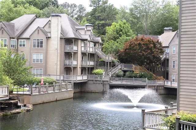 a house with lots of trees in the background