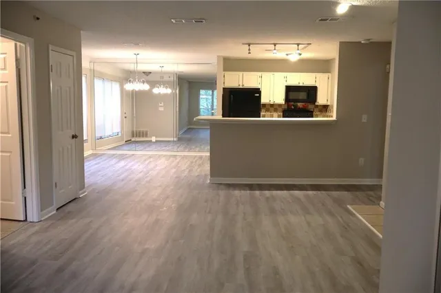 a view of a big room with wooden floor