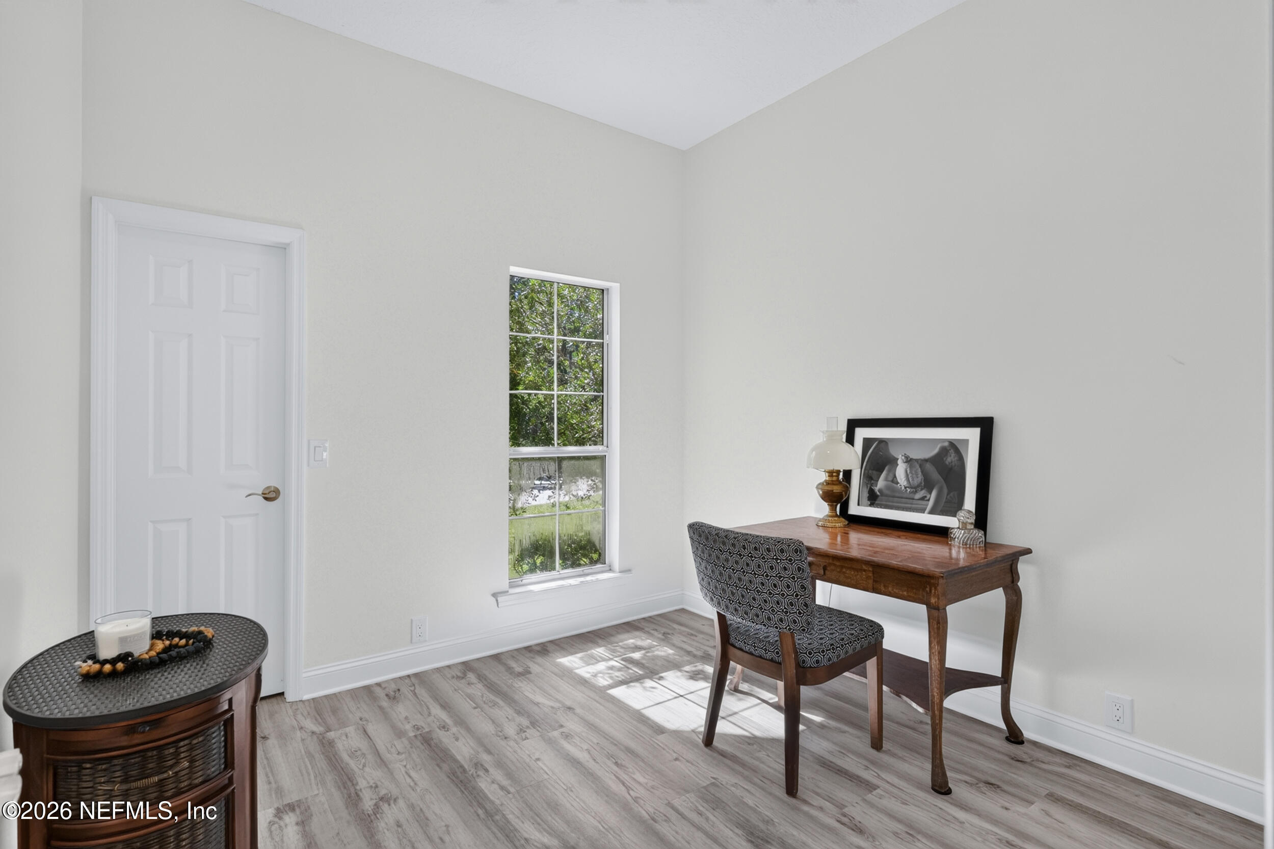 3090 Monument Bay Road St. Augustine, FL 32092 - Photo 32 of 56 a view of a workspace with furniture and a window