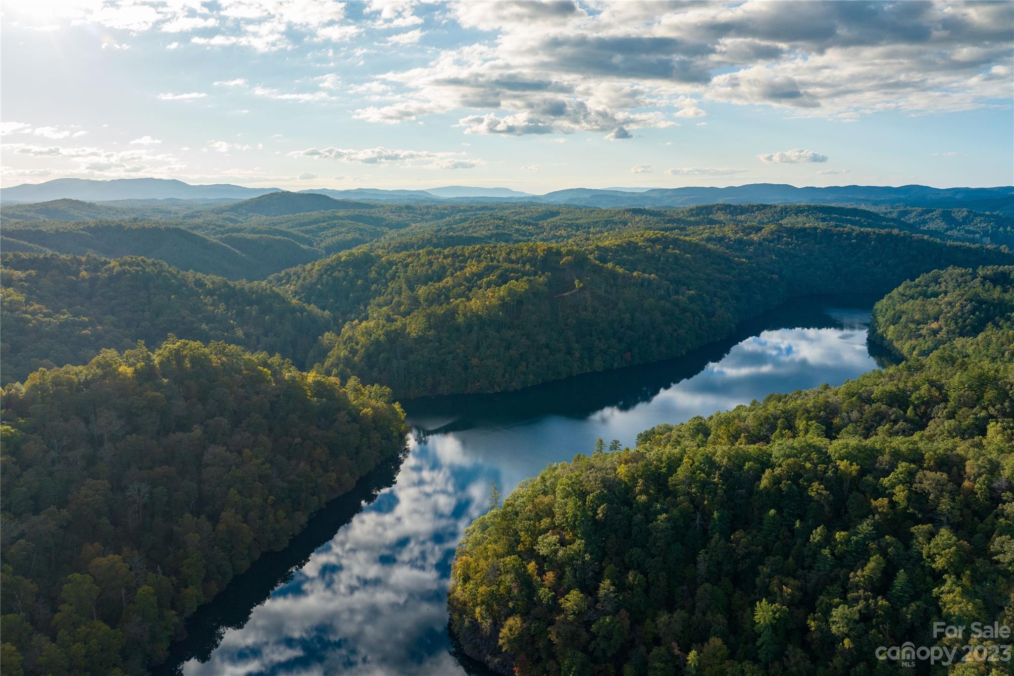 a view of a lake with mountains in the background