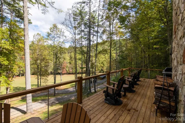 a view of balcony with chairs and wooden floor