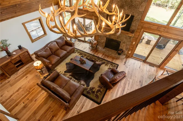 a view of living room with furniture and a fireplace