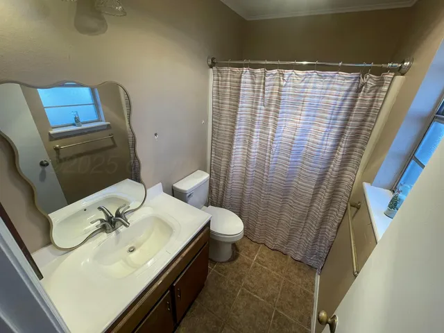 a bathroom with a sink and toilet
