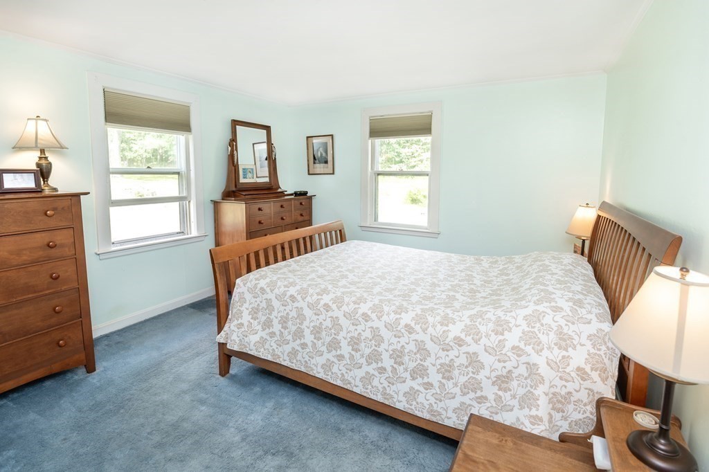 89 Whitney Road Ashby, MA 01431 - Photo 13 of 30 a bedroom with a bed and window