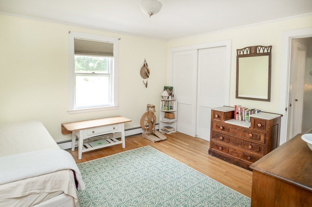 89 Whitney Road Ashby, MA 01431 - Photo 14 of 30 a room with a bed and a window