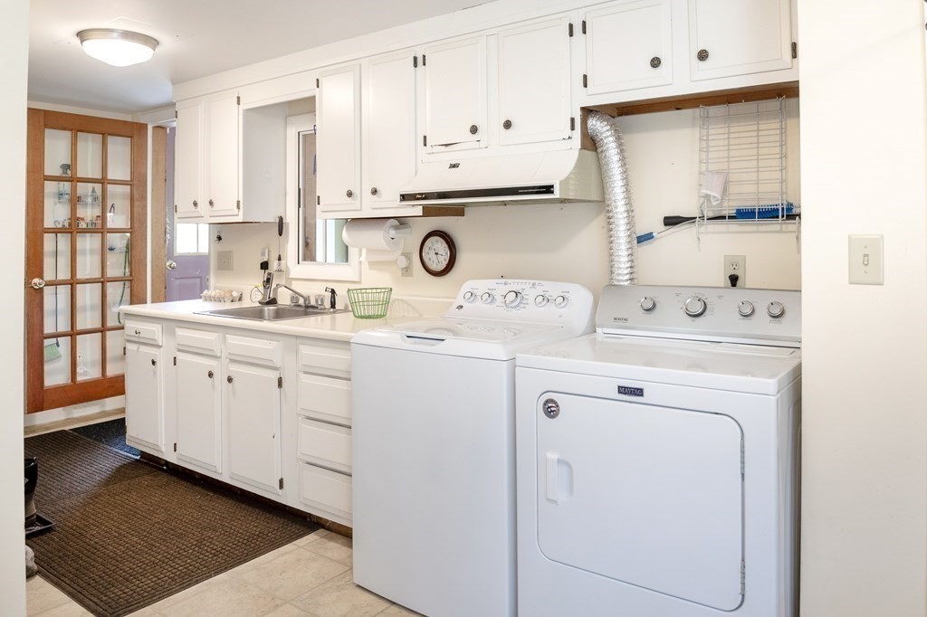 89 Whitney Road Ashby, MA 01431 - Photo 15 of 30 a kitchen with cabinets appliances a sink and a window