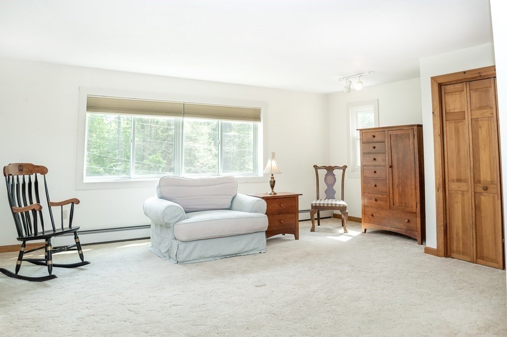 89 Whitney Road Ashby, MA 01431 - Photo 17 of 30 a living room with furniture and a window