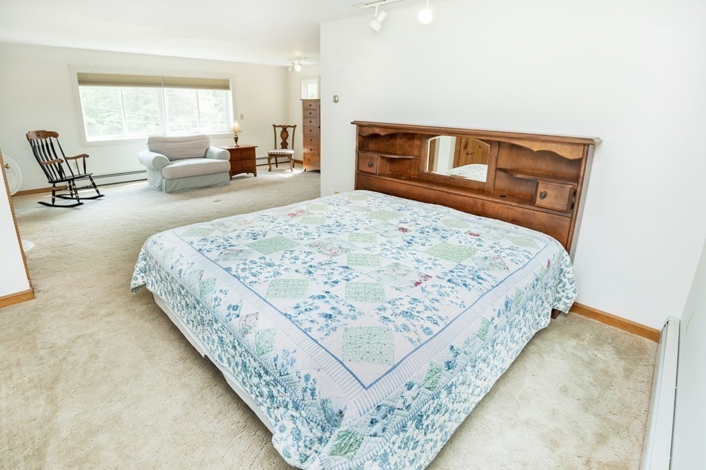 89 Whitney Road Ashby, MA 01431 - Photo 18 of 30 a bedroom with bed and window