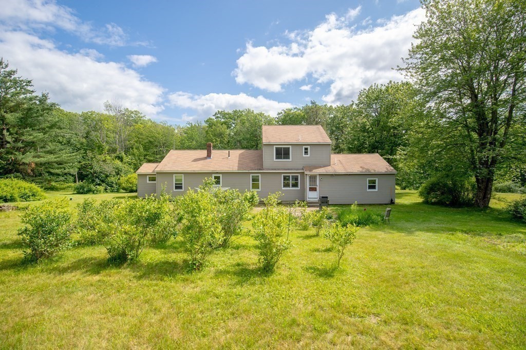 89 Whitney Road Ashby, MA 01431 - Photo 20 of 30 a aerial view of a house with pool and garden
