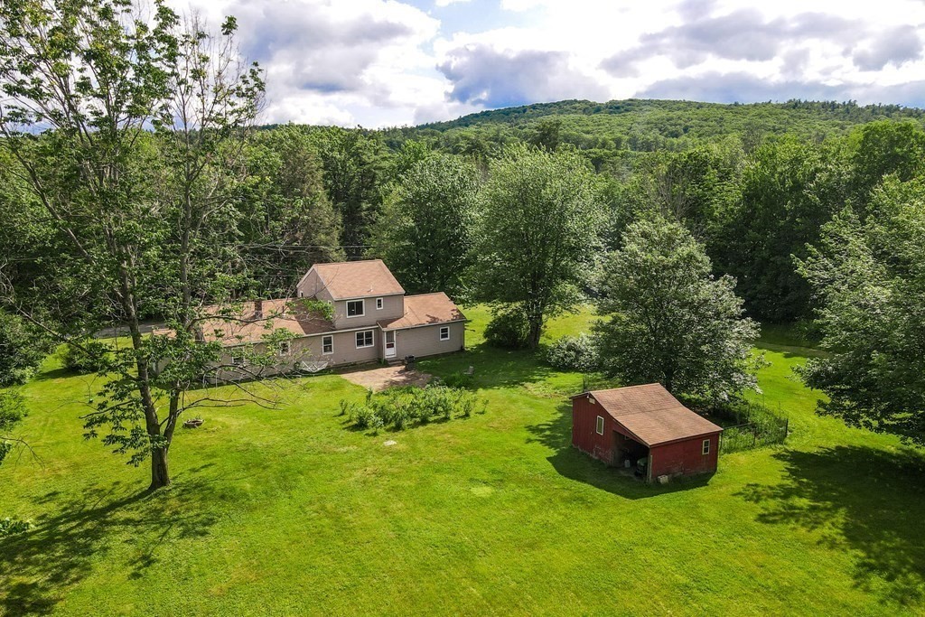 89 Whitney Road Ashby, MA 01431 - Photo 22 of 30 a view of a garden with a house