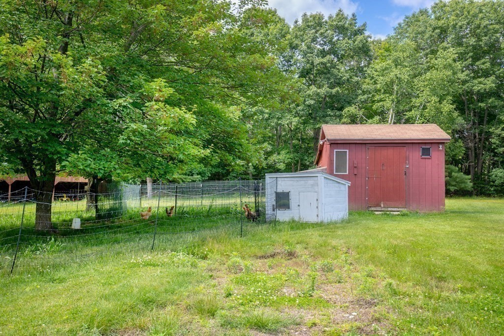 89 Whitney Road Ashby, MA 01431 - Photo 24 of 30 a view of a house with a backyard