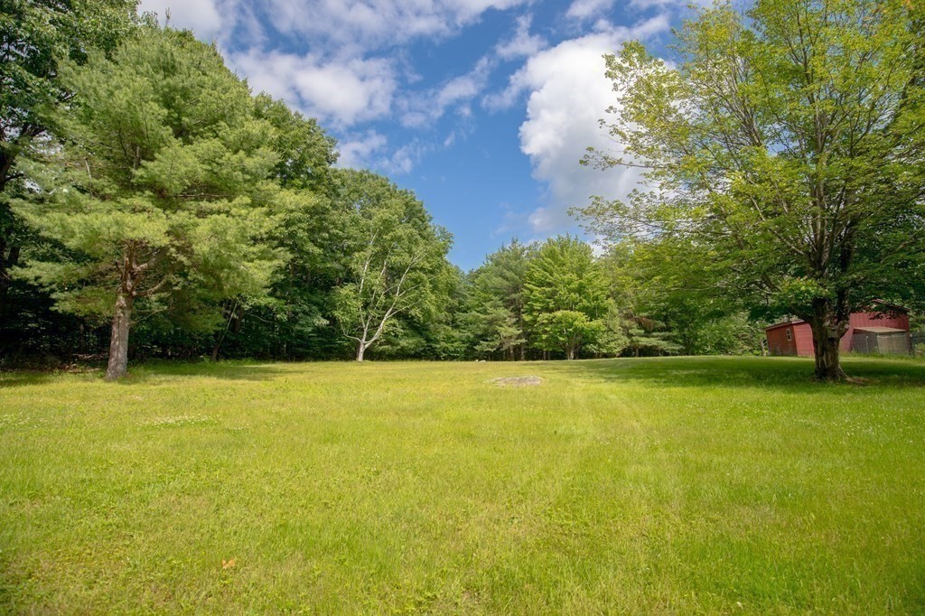 89 Whitney Road Ashby, MA 01431 - Photo 26 of 30 a view of a field with trees in the background