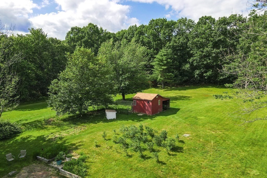 89 Whitney Road Ashby, MA 01431 - Photo 28 of 30 a view of a chair and table in the garden
