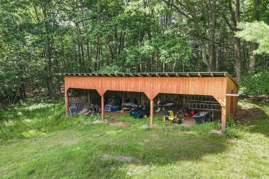 89 Whitney Road Ashby, MA 01431 - Photo 29 of 30 a view of outdoor space with deck and tree