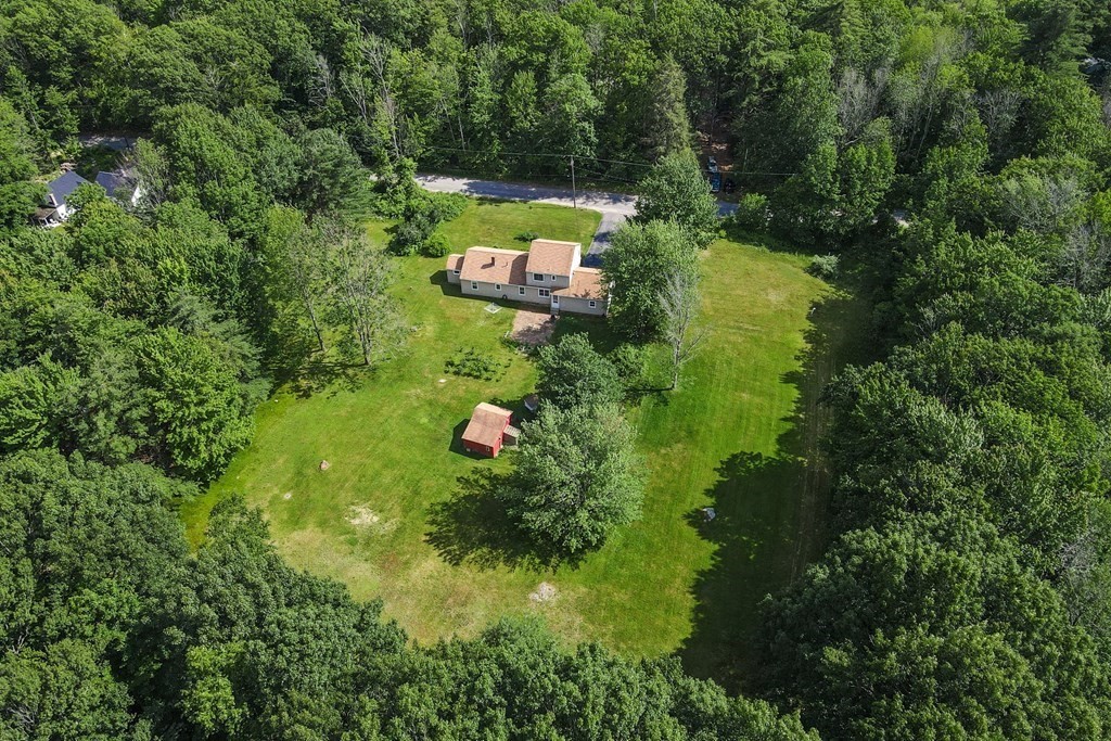 89 Whitney Road Ashby, MA 01431 - Photo 30 of 30 a view of a house with a yard