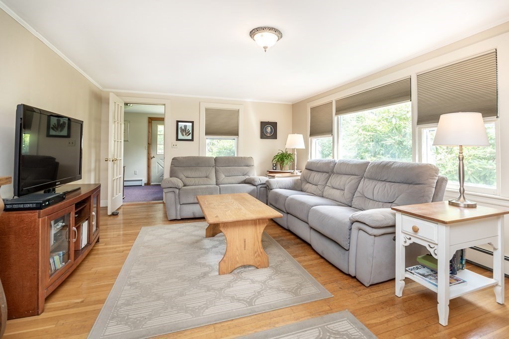89 Whitney Road Ashby, MA 01431 - Photo 8 of 30 a living room with furniture and a flat screen tv