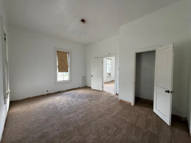 an empty room with windows