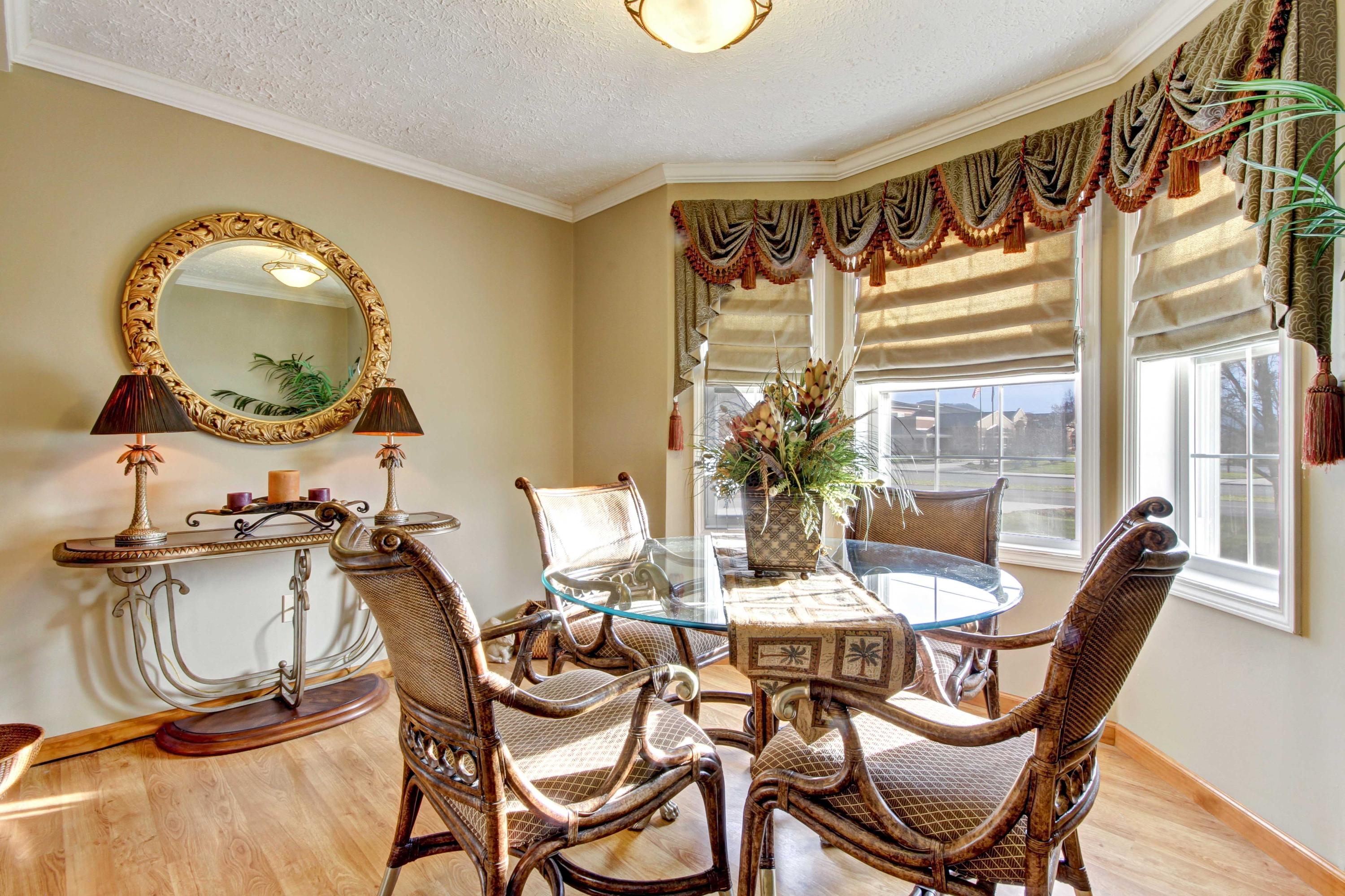 4690 Crosier Road Elliston, VA 24087 - Photo 18 of 79 a dining room with furniture a mirror and wooden floor
