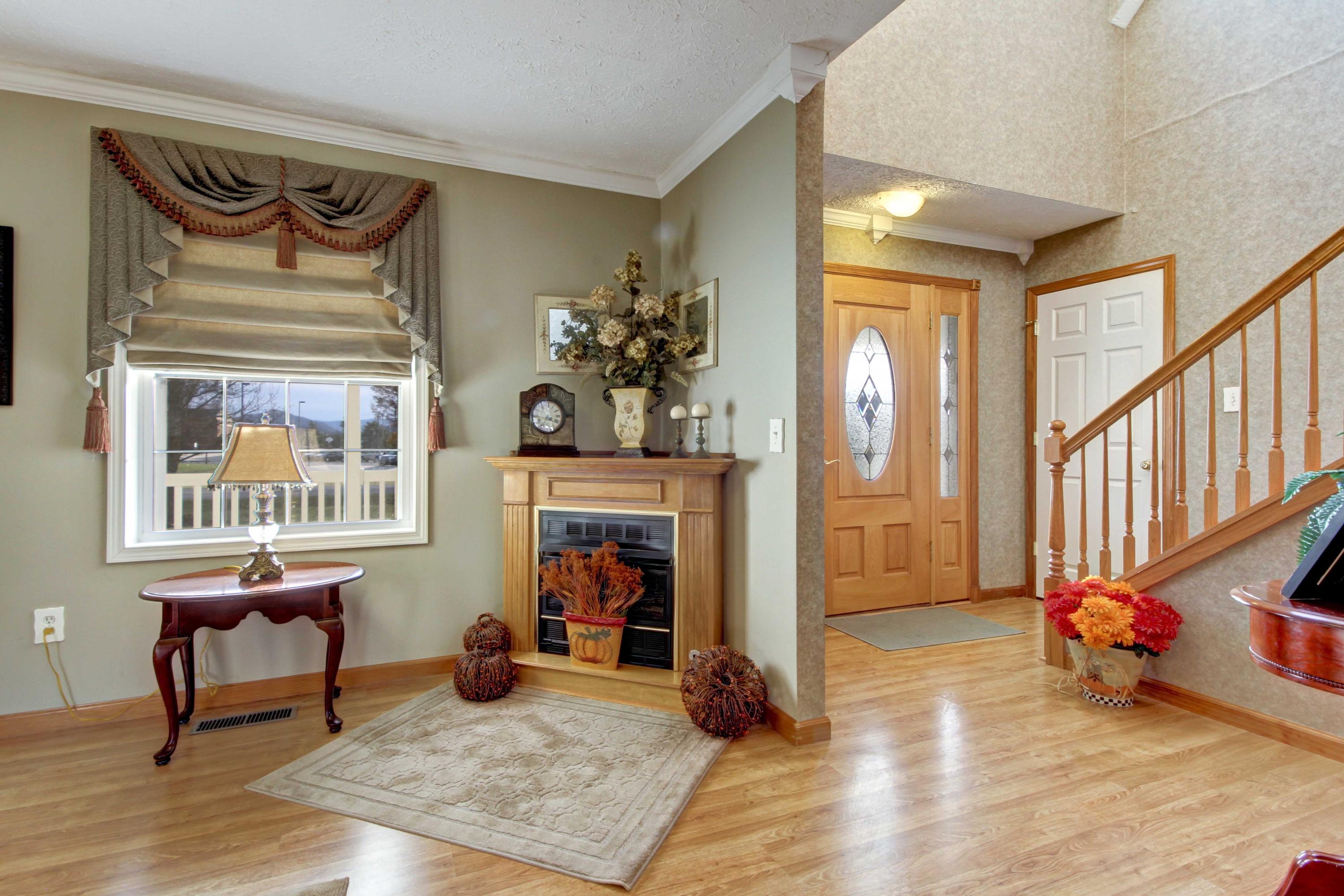 4690 Crosier Road Elliston, VA 24087 - Photo 21 of 79 a bedroom with furniture and a fireplace