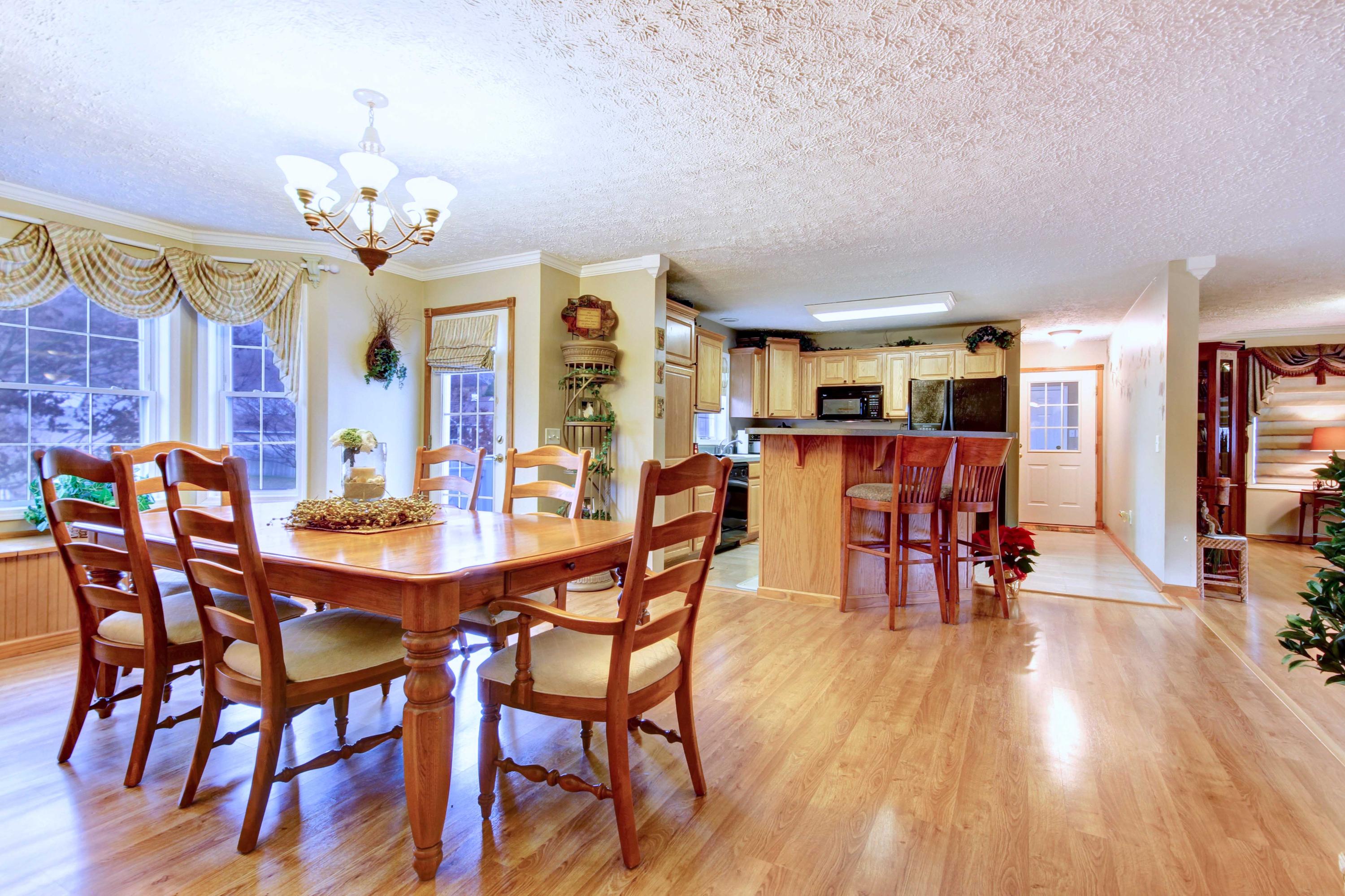 4690 Crosier Road Elliston, VA 24087 - Photo 27 of 79 a view of a dining room with furniture and wooden floor
