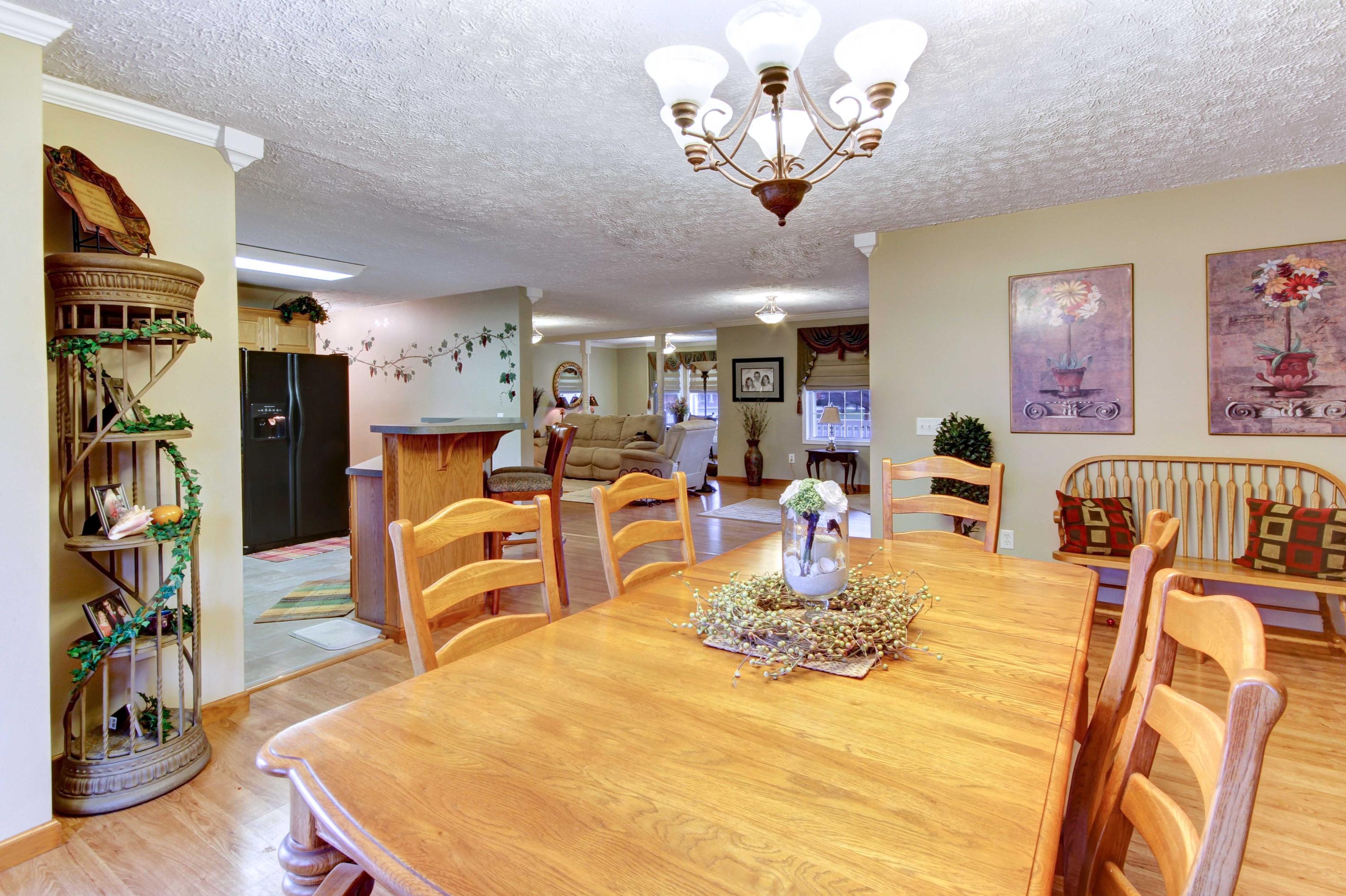 4690 Crosier Road Elliston, VA 24087 - Photo 28 of 79 a view of a dining room with furniture a chandelier and wooden floor