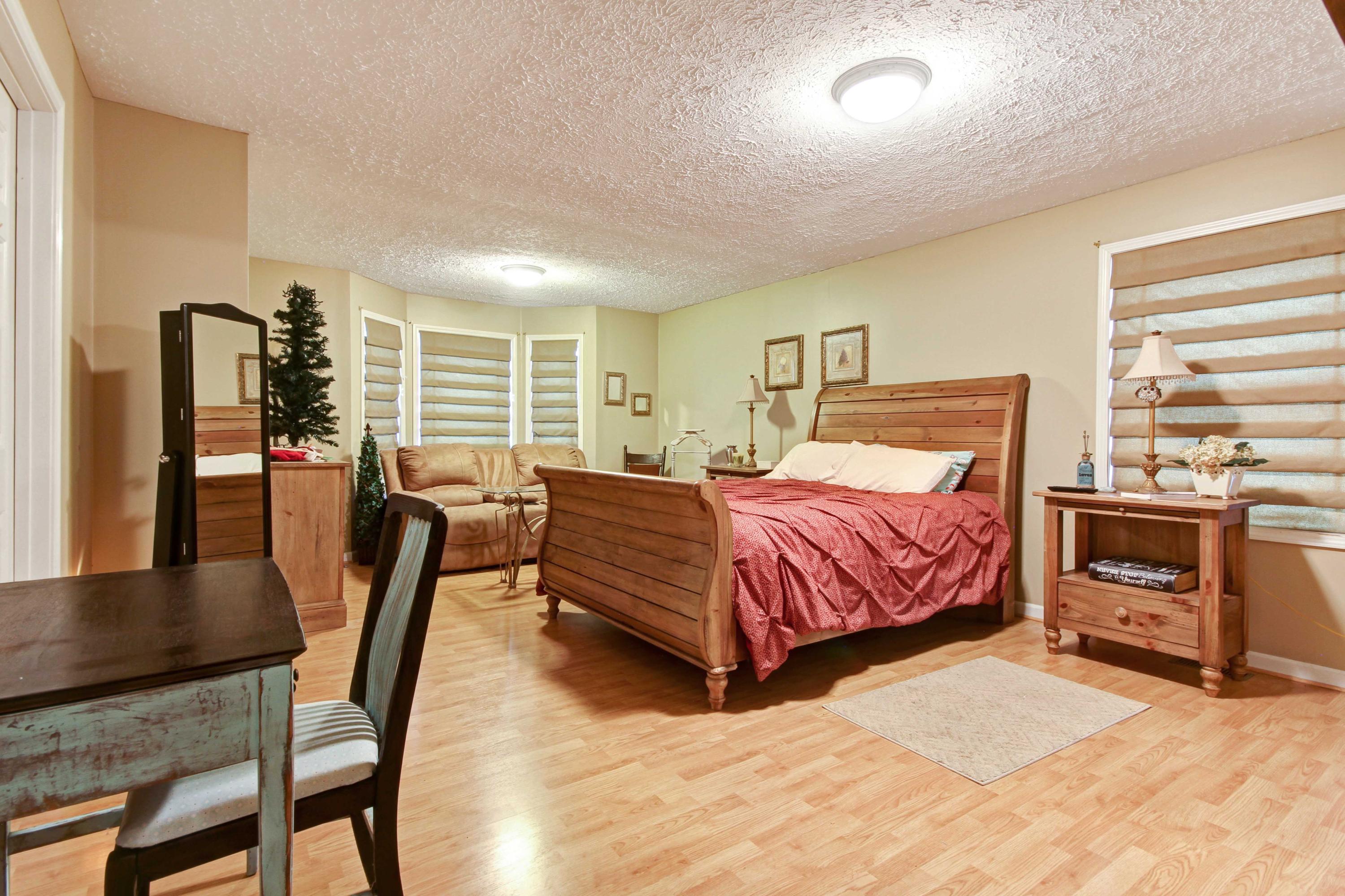 4690 Crosier Road Elliston, VA 24087 - Photo 31 of 79 a bedroom with a bed and furniture