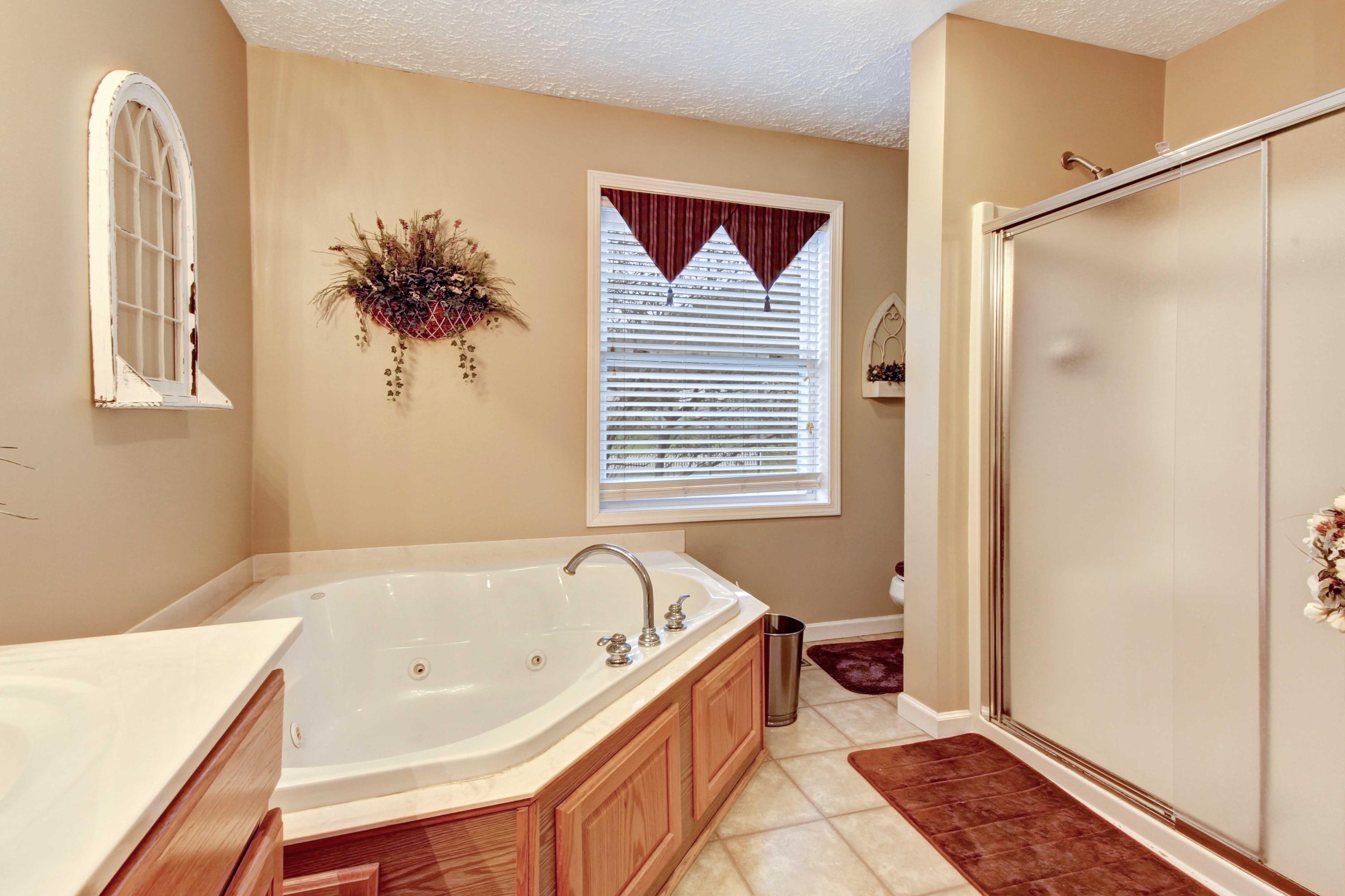 4690 Crosier Road Elliston, VA 24087 - Photo 34 of 79 a bathroom with a bathtub and a shower