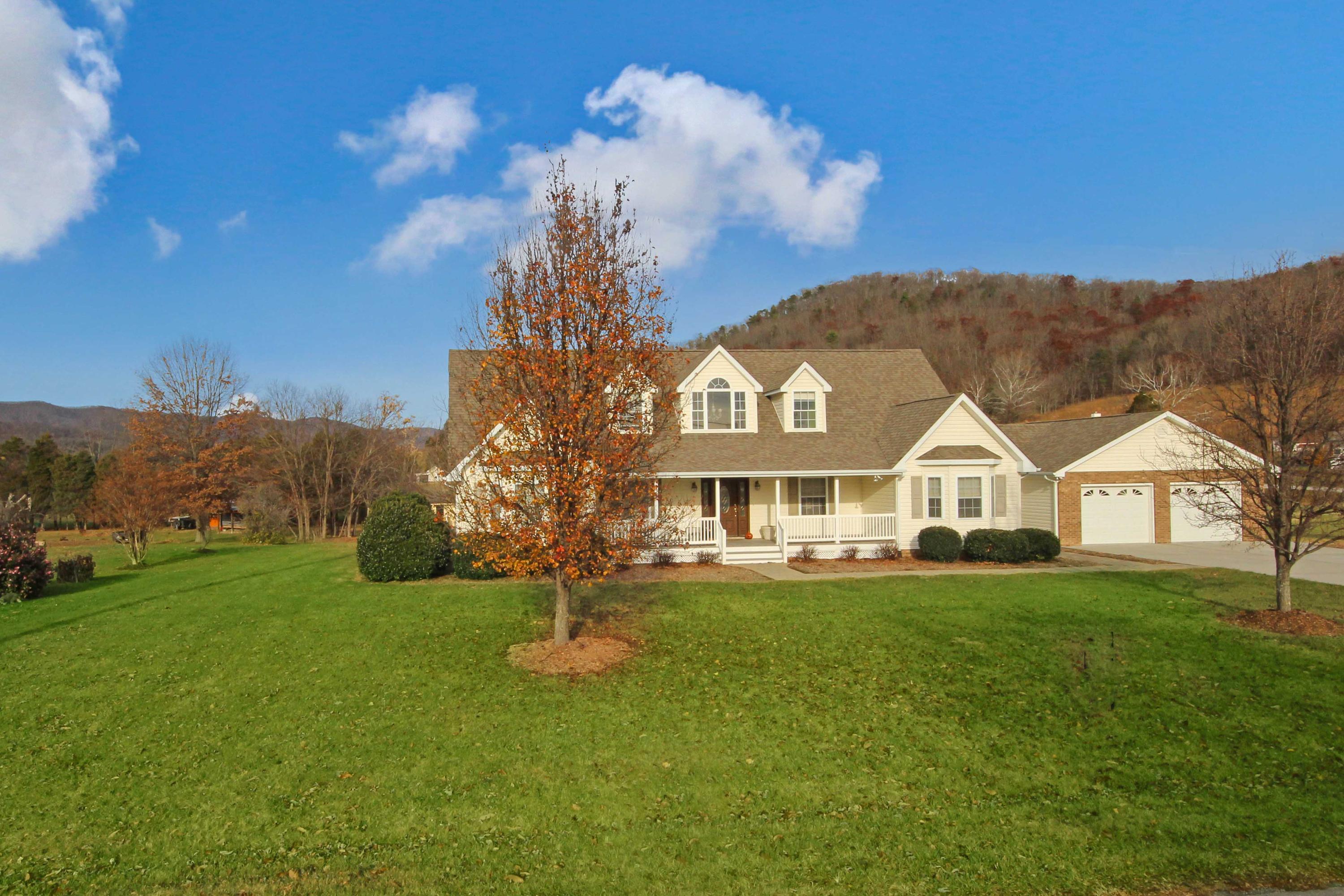 4690 Crosier Road Elliston, VA 24087 - Photo 5 of 79 a front view of a house with a garden